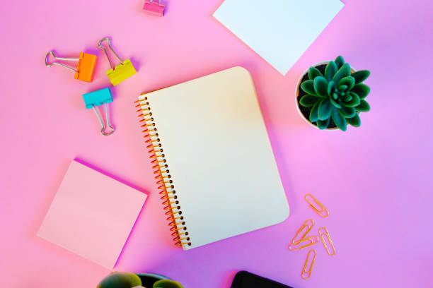 istock Minimalist workspace with notebook and succulent plant 1288636753