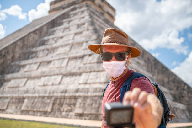 Man takes selfie in Mexico, he wears face mask