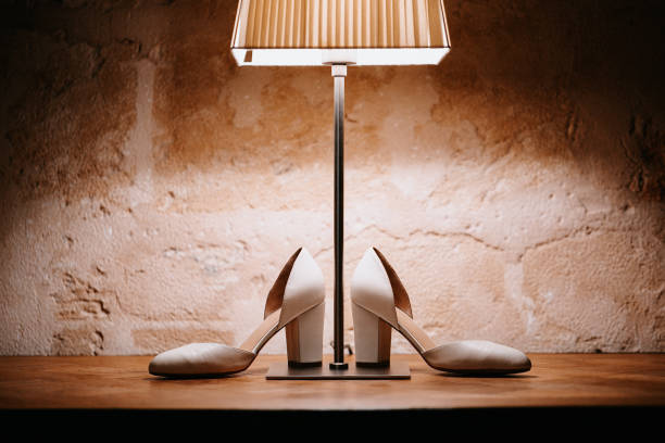 istock White bridal wedding shoes under a floor lamp 1288637737