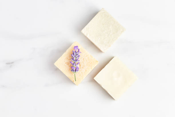 istock natural eco soap decorated with lavender flower on a marble background. copy space, flat layout 1288638221