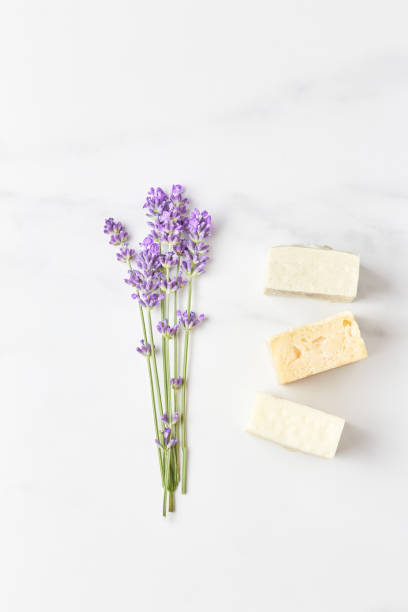 istock stack of handmade soap, mini lavender bouquet on marble background. flat lay, top view 1288638226