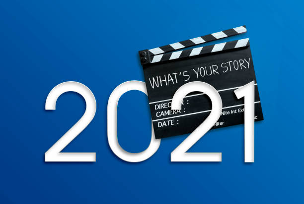 istock what's your story.Text title on clapperboard.New 2021 storytelling concept. 1288641156