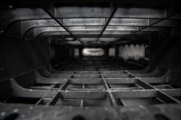 Used plastic shipping pallets in recycling center, close up