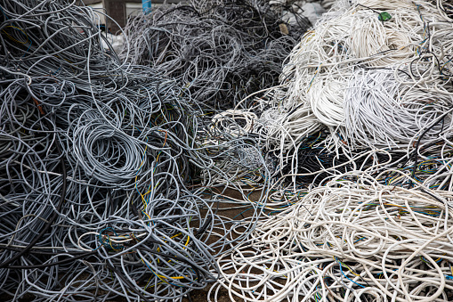 Large heap od cables and wires ready for recycling in factory
