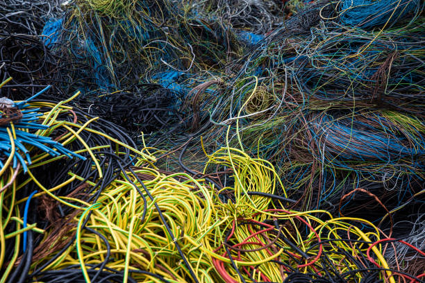 Scrap cables and wires ready for recycling Large heap od cables and wires ready for recycling in factory copper cable stock pictures, royalty-free photos & images