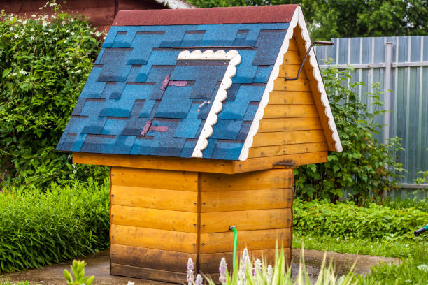 istock A beautiful village well with a blue roof. 1288643071