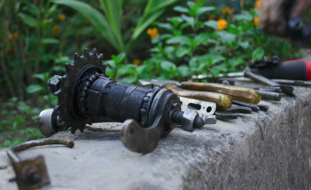 istock Tools and accessories set for cycling. Accessories for bicycles trips: universal screwdriver tool and screws, glasses, bicycle mirror, pump, water holder, speedometer. Bike tools and spares. 1288645517