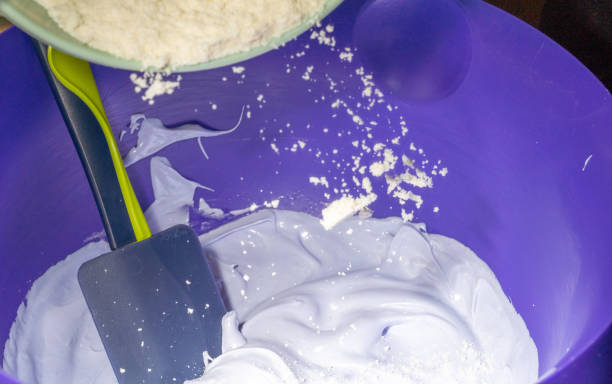 istock Adding almond flour to the lilac meringue. 1288646704