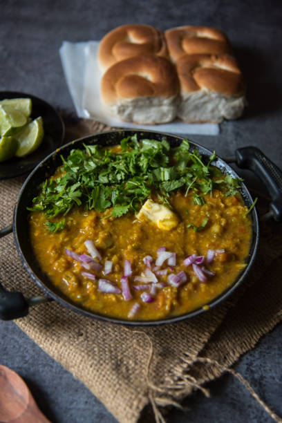 istock Close up of Indian snacks pav bhaji or bread masala curry 1288648083