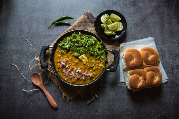istock Indian snacks pav bhaji or bread masala curry in a black pan 1288648104