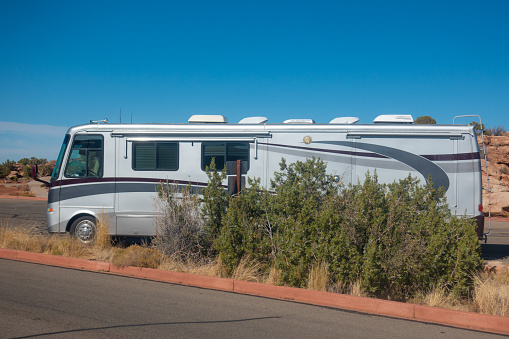 RV Car truck in desert parking lot. Road trip concept.
