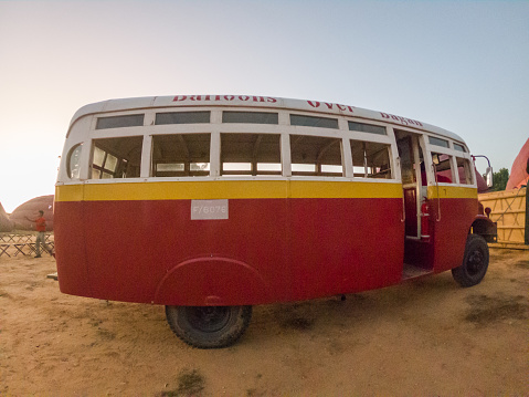 11/15/2019 Bagan, Myanmar\nVintage bus picking up people to go on a hot air ballon flight