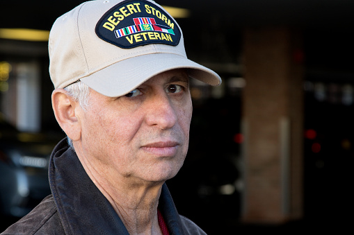 Veteran wearing baseball cap with “Desert Storm Veteran” lettering.