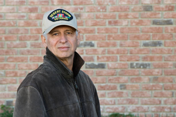 istock Gulf War Veteran outdoors looking at camera with a serious look 1288652301