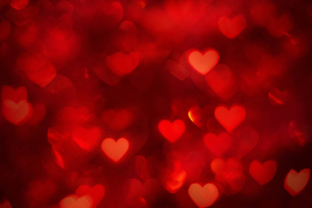 istock Defocused background with heart shapes 1288652697