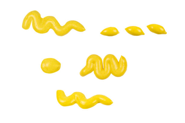 istock Yellow cheese sauce splashes isolated on white background. 1288653641