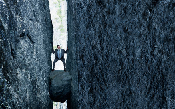 istock Stuck Between A Rock And A Hard Place 1288653750