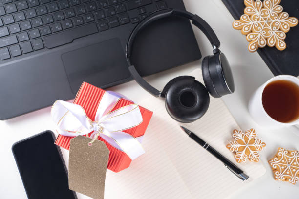 istock Office desk with Christmas gift 1288663225