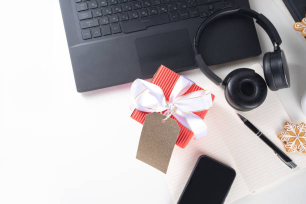 istock Office desk with Christmas gift 1288663234