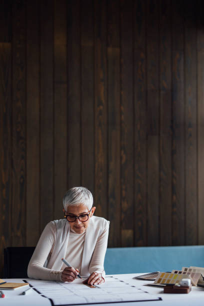 istock Elegant Elderly Designer Making an Outline for her Latest Project (Copy Space) 1288664631