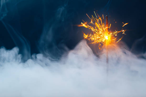 istock fire sparkler in dense smoke, abstract Christmas firework background 1288665506