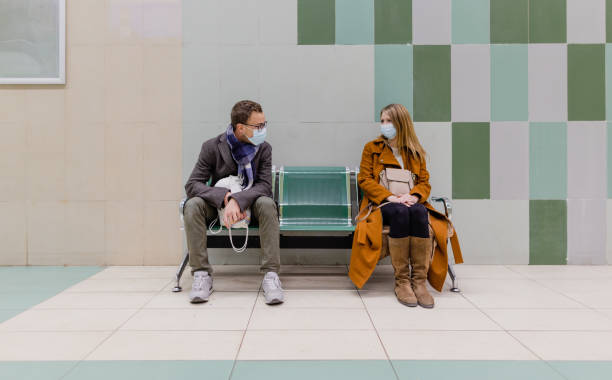 istock People with face mask waiting for a train in underground station 1288665966