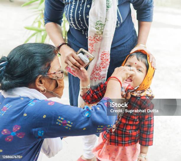 Pulse Polio Vaccination Programme In West Bengal Stock Photo - Download Image Now - Polio Vaccine, Polio, Drop