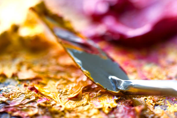 istock mixing oil paints with a brush 1288668515