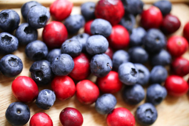 Berries: blackberries, blueberries, cranberry on a white background
