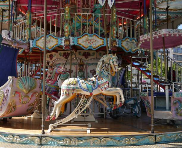 istock Old carousel with horse and gondola 1288672333