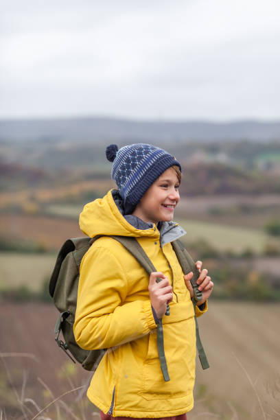 istock Happy little hiker during autumn day on a hill. 1288672562