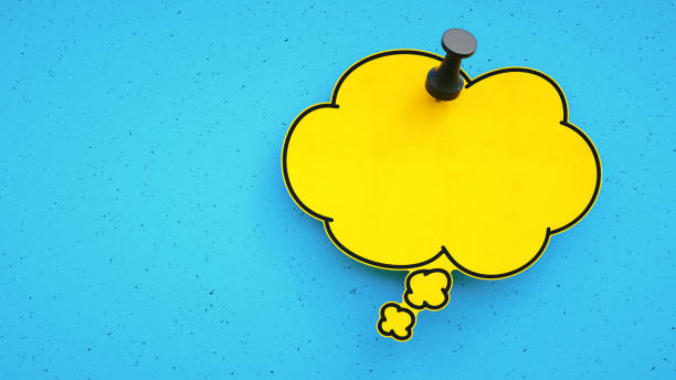 istock A blank yellow thought bubble note pinned to a blue background. Designed for additional composition. 1288674298