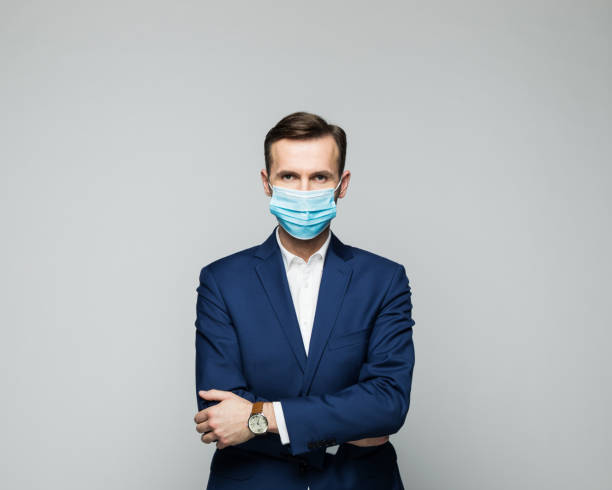 istock Mature businessman wearing protective face mask 1288676190