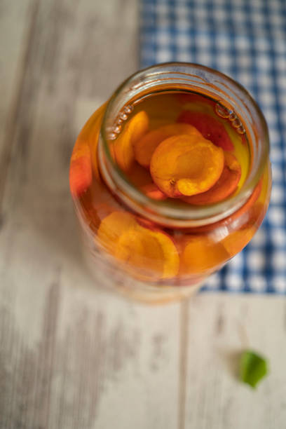 istock Canned peaches fruit in a glass jar 1288676392