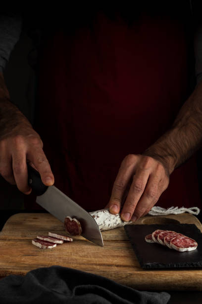 istock Cutting salchichon, dark food style, vertical 1288680947