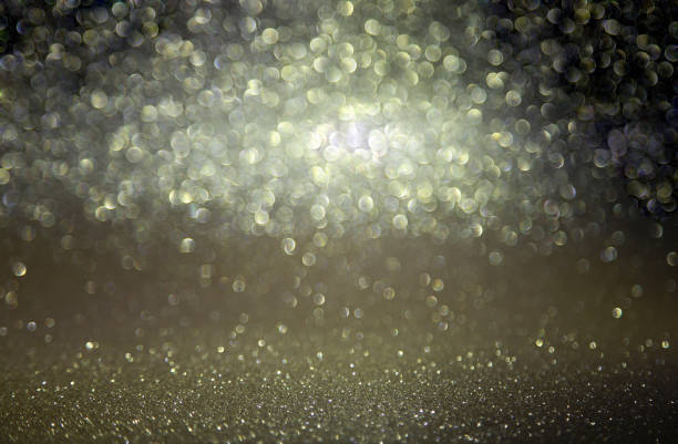 istock Sparkling lights, bokeh festive background with texture. 1288681916