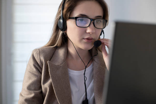 istock Young woman working in a call center 1288683050