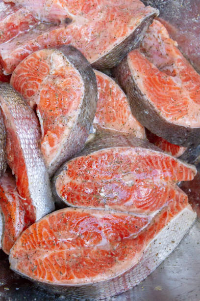 istock Fresh trout steaks are marinated in a metal bowl before cooking 1288686336