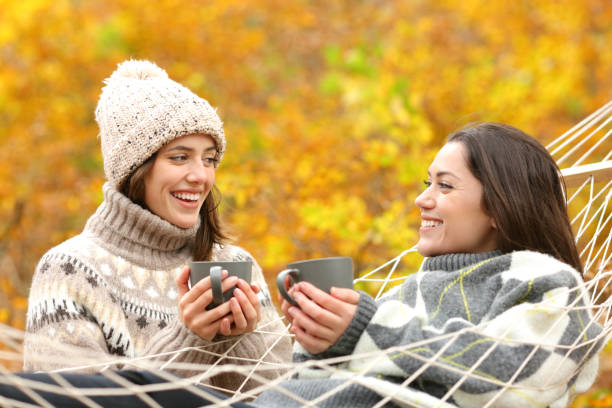 istock Happy friends talking in autumn holiday 1288691321