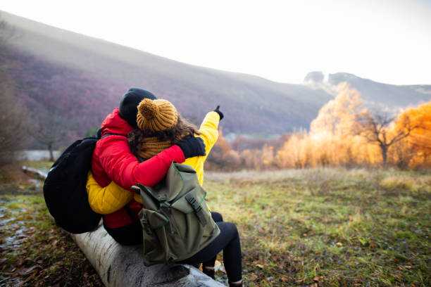 istock Adventurous couple enjoys in beautiful view from forest 1288693982