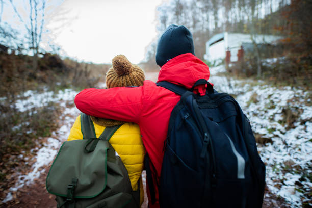 istock Couple hiking in the forest at the winter 1288694126