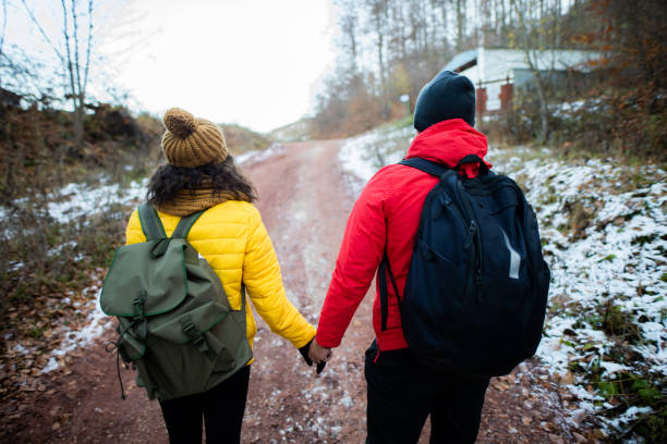 istock Adventurous couple enjoys in winter hiking 1288694133