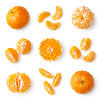 Set of fresh whole, peeled and sliced mandarin, tangerine or clementine isolated on white bcakground, top view
