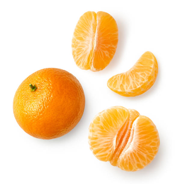 Fresh ripe whole and sliced mandarin, tangerine or clementine Fresh ripe whole and sliced mandarin, tangerine or clementine isolated on white background, top view tangerine stock pictures, royalty-free photos & images