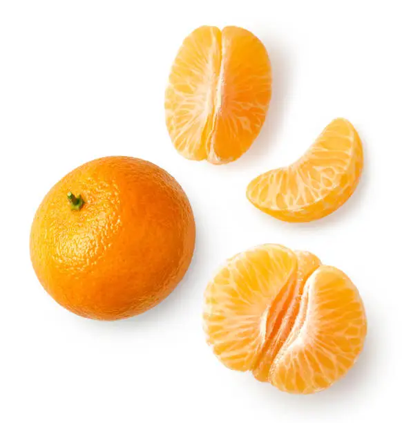 Photo of Fresh ripe whole and sliced mandarin, tangerine or clementine