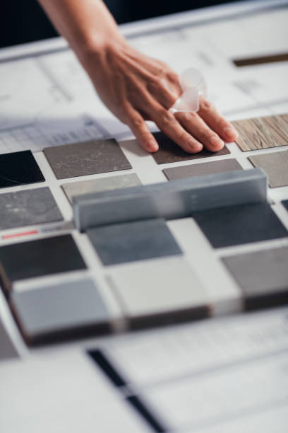 istock Interior Design Project Development: Hand of an Unrecognizable Woman Architect Touching a Sample Palette, a Close Up 1288707203