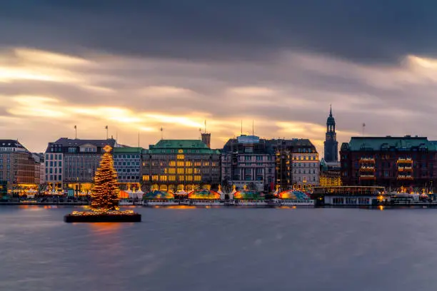 Hamburg town hall and Alster Lake with Christmas market.