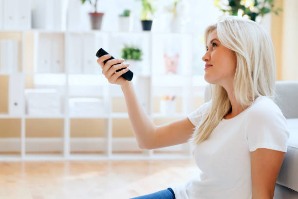 istock Young woman watching TV 1288707458