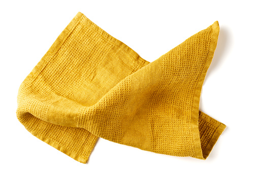Crumpled yellow fabric napkin isolated on white background