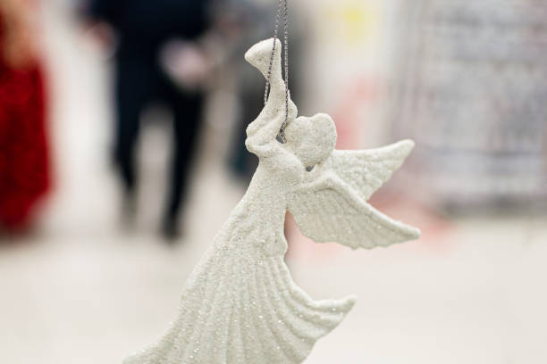 white tree toy Angel with glitters, soft focus